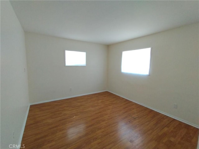 13410 Berg St, Sylmar, CA 91342 - empty room with wood finished floors and baseboards