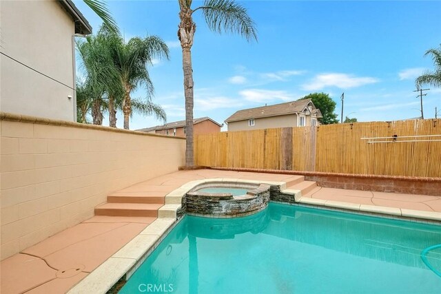 13203 Gyna Ln, La Puente, CA 91746 - view of swimming pool with a pool with connected hot tub and a fenced backyard