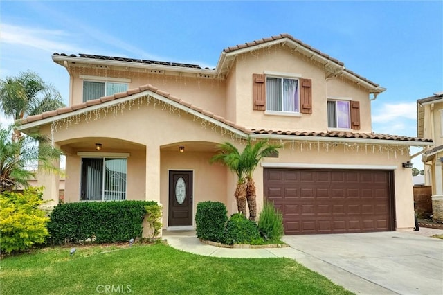 13203 Gyna Ln, La Puente, CA 91746 - mediterranean / spanish home with stucco siding, driveway, a tile roof, a garage, and a front yard