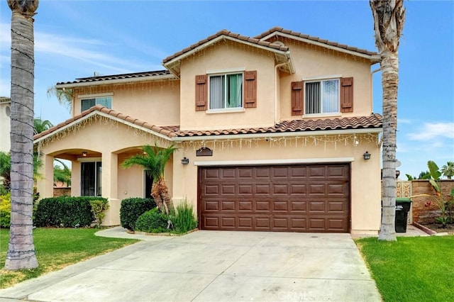 13203 Gyna Ln, La Puente, CA 91746 - mediterranean / spanish-style home with driveway, stucco siding, an attached garage, and a tile roof
