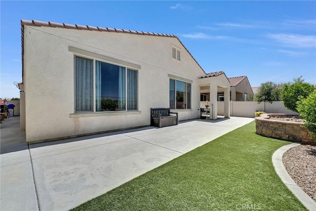 11444 River Run St, Apple Valley, CA 92308 - rear view of house featuring a patio area, stucco siding, and a tiled roof