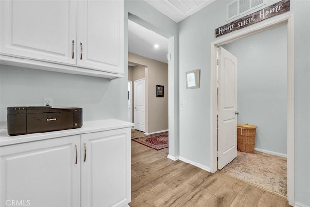 11444 River Run St, Apple Valley, CA 92308 - kitchen with light wood-style flooring, white cabinetry, light countertops, and recessed lighting