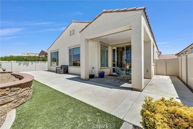 11444 River Run St, Apple Valley, CA 92308 - rear view of property with a patio area, stucco siding, and a fenced backyard