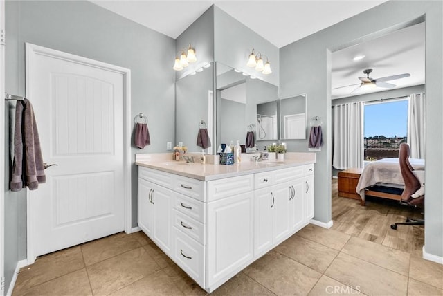 11444 River Run St, Apple Valley, CA 92308 - ensuite bathroom featuring double vanity, tile patterned flooring, and a ceiling fan