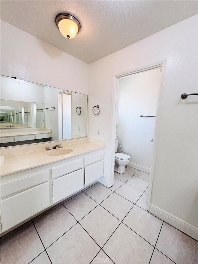 10349 Victoria St, Rancho Cucamonga, CA 91701 - bathroom with vanity, a textured ceiling, and tile patterned flooring