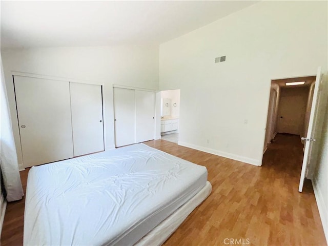 10349 Victoria St, Rancho Cucamonga, CA 91701 - bedroom featuring two closets, high vaulted ceiling, and light wood-style floors