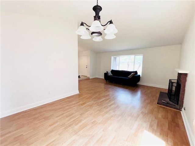 10349 Victoria St, Rancho Cucamonga, CA 91701 - living room featuring a chandelier and light wood finished floors