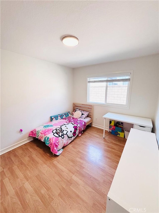 10349 Victoria St, Rancho Cucamonga, CA 91701 - bedroom with light wood-style flooring and baseboards