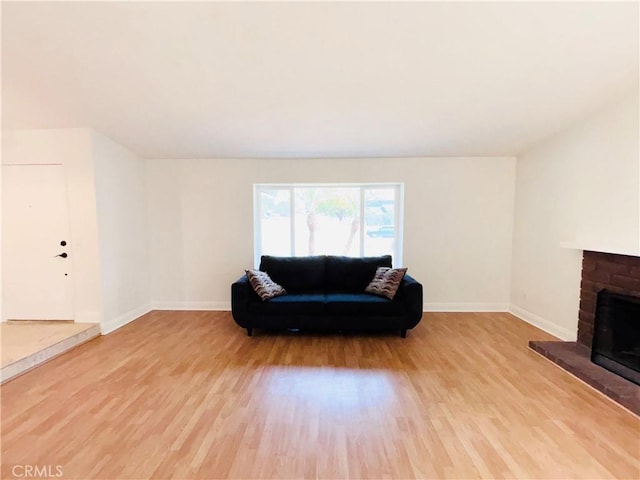 10349 Victoria St, Rancho Cucamonga, CA 91701 - living area featuring wood finished floors and a fireplace