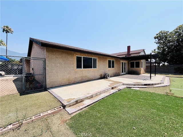 10349 Victoria St, Rancho Cucamonga, CA 91701 - back of house featuring a patio, stucco siding, and a gate