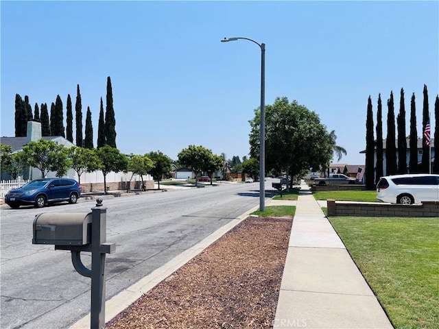 10349 Victoria St, Rancho Cucamonga, CA 91701 - view of asphalt road with street lighting and sidewalks