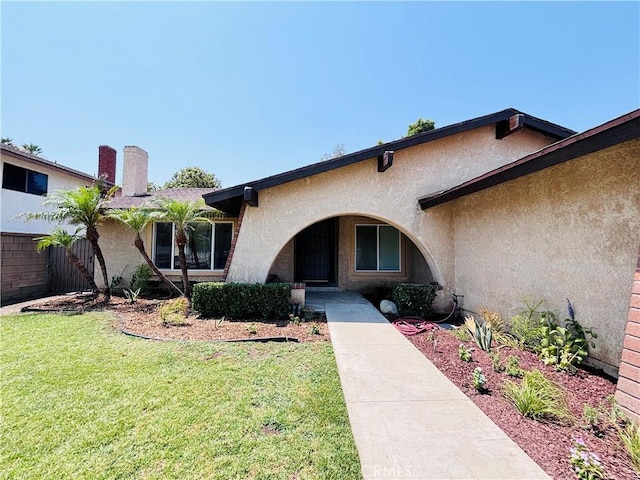 10349 Victoria St, Rancho Cucamonga, CA 91701 - doorway to property featuring stucco siding and a yard