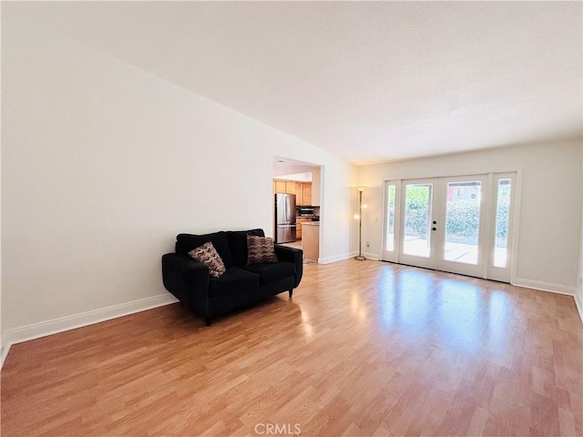 10349 Victoria St, Rancho Cucamonga, CA 91701 - sitting room featuring light wood-style flooring, french doors, and lofted ceiling
