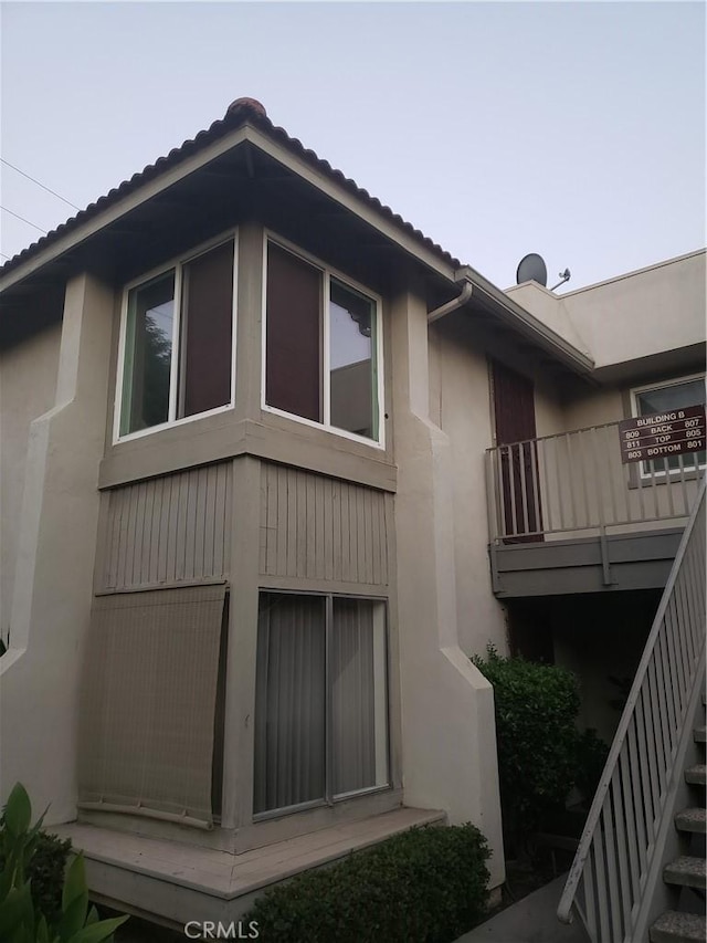 811 Cinnamon Ln, Duarte, CA 91010 - view of home's exterior with stairway and stucco siding