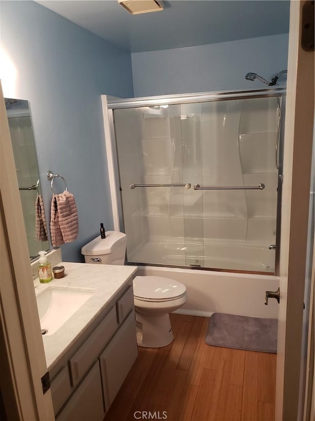 811 Cinnamon Ln, Duarte, CA 91010 - bathroom featuring vanity, wood finished floors, and bath / shower combo with glass door