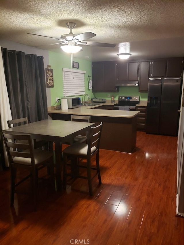 811 Cinnamon Ln, Duarte, CA 91010 - dining area featuring a textured ceiling, dark wood-style floors, and a ceiling fan