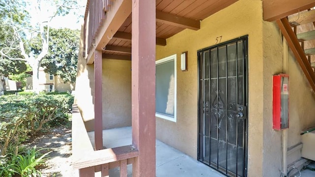 1000 W Macarthur Blvd Unit 57, Santa Ana, CA 92707 - doorway to property with stucco siding
