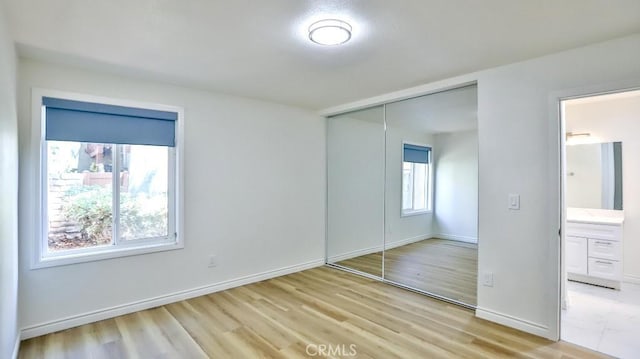 1000 W Macarthur Blvd Unit 57, Santa Ana, CA 92707 - unfurnished bedroom with a closet and light wood-style flooring