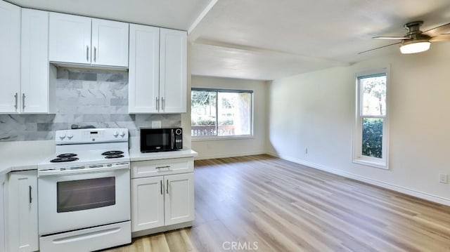 1000 W Macarthur Blvd Unit 57, Santa Ana, CA 92707 - kitchen featuring electric stove, black microwave, light wood-style floors, and light countertops