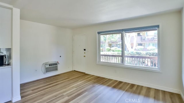 1000 W Macarthur Blvd Unit 57, Santa Ana, CA 92707 - unfurnished living room with light wood-style flooring and heating unit
