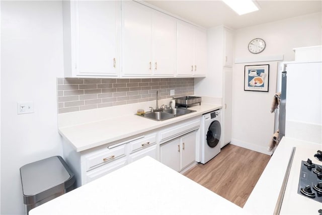 6160 Whitsett Ave Unit 4, North Hollywood, CA 91606 - kitchen featuring washer / clothes dryer, light countertops, white cabinetry, and decorative backsplash