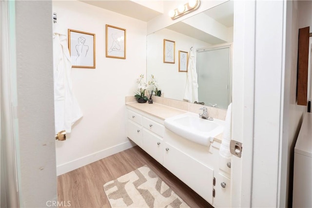 6160 Whitsett Ave Unit 4, North Hollywood, CA 91606 - bathroom with wood finished floors, vanity, and an enclosed shower