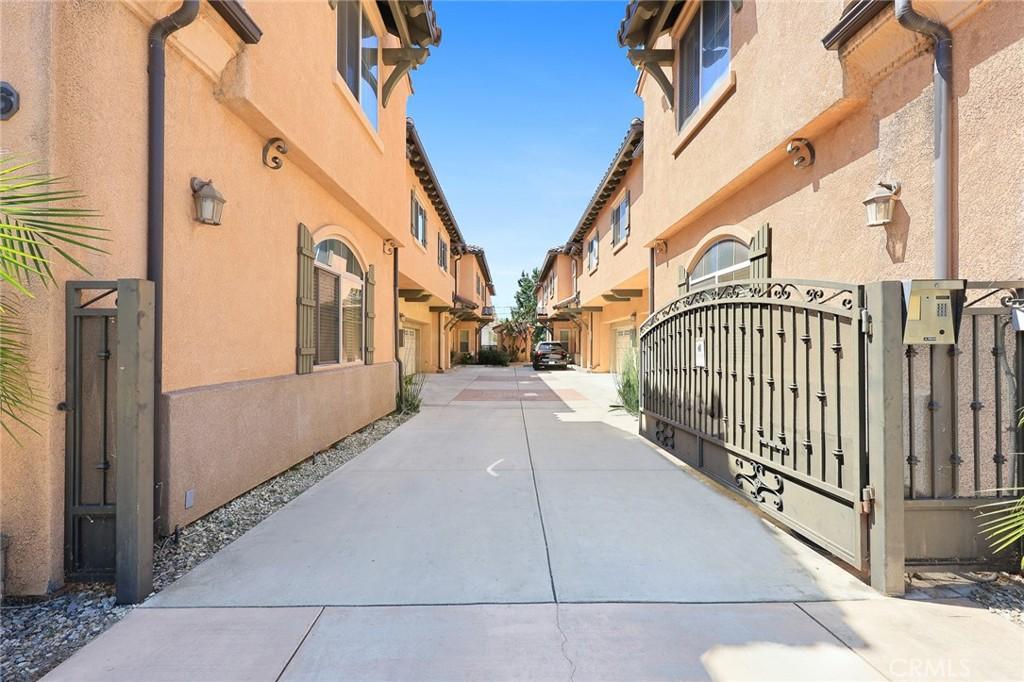 156 El Dorado St Unit B, Arcadia, CA 91006 - view of concrete road featuring a gate and a residential view