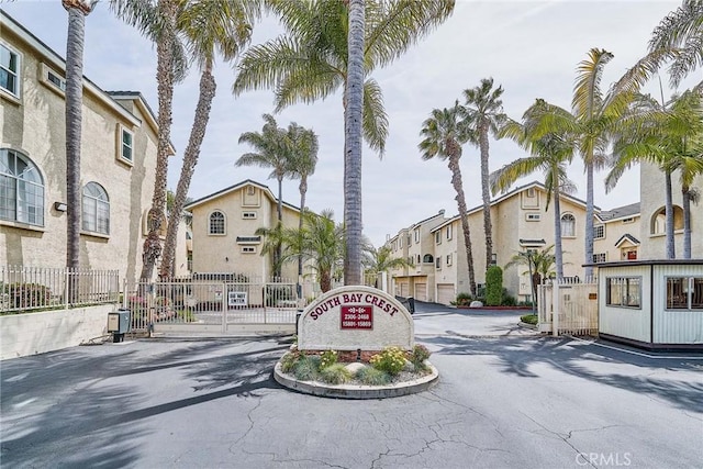 15832 Apollo Pl, Gardena, CA 90249 - view of asphalt road featuring a residential view, a gated entry, and curbs