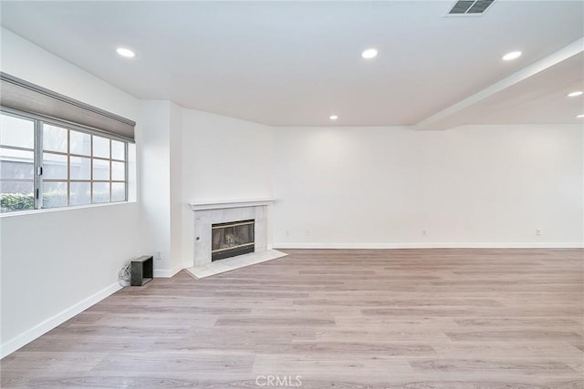 15832 Apollo Pl, Gardena, CA 90249 - unfurnished living room featuring a fireplace, recessed lighting, and light wood finished floors