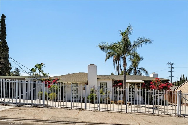 7314 Summitrose St, Tujunga, CA 91042 - ranch-style home featuring a fenced front yard and a chimney