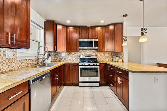 7314 Summitrose St, Tujunga, CA 91042 - kitchen featuring appliances with stainless steel finishes, a peninsula, light stone counters, decorative backsplash, and recessed lighting