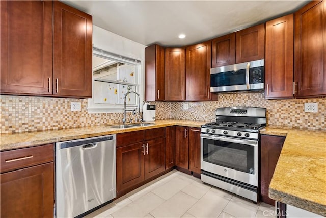 7314 Summitrose St, Tujunga, CA 91042 - kitchen featuring appliances with stainless steel finishes, tasteful backsplash, recessed lighting, light stone counters, and light tile patterned floors