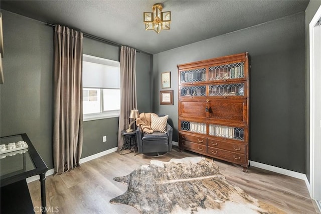 24754 Masters Cup Way, Valencia, CA 91355 - sitting room with wood finished floors and a chandelier