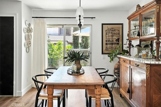 24754 Masters Cup Way, Valencia, CA 91355 - dining room with light wood-style floors and baseboards