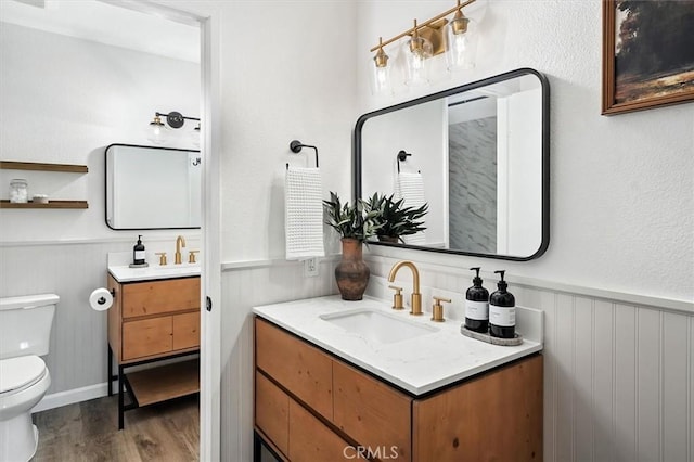 24754 Masters Cup Way, Valencia, CA 91355 - bathroom with vanity, a wainscoted wall, and wood finished floors