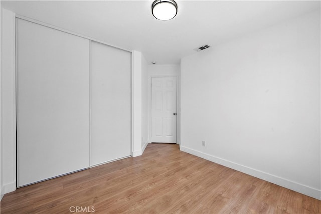 827 La Cadena Ln, Corona, CA 92879 - unfurnished bedroom featuring light wood-style flooring and a closet
