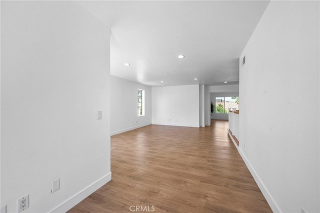 827 La Cadena Ln, Corona, CA 92879 - empty room featuring plenty of natural light, recessed lighting, and wood finished floors