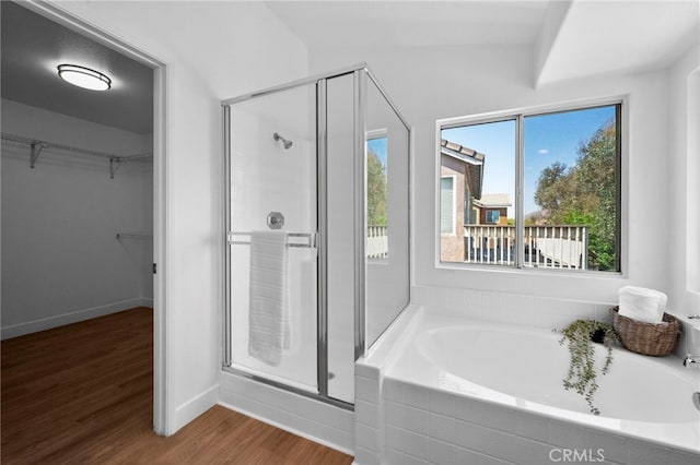 827 La Cadena Ln, Corona, CA 92879 - full bathroom with a shower stall, a bath, wood finished floors, and a walk in closet