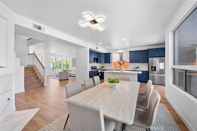 827 La Cadena Ln, Corona, CA 92879 - dining area featuring healthy amount of natural light, light wood-type flooring, stairway, and recessed lighting