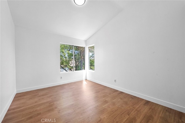 827 La Cadena Ln, Corona, CA 92879 - empty room with vaulted ceiling and wood finished floors