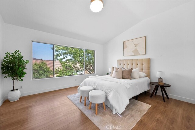 827 La Cadena Ln, Corona, CA 92879 - bedroom featuring lofted ceiling and wood finished floors