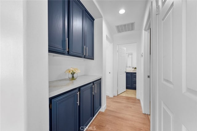 827 La Cadena Ln, Corona, CA 92879 - corridor with light wood-type flooring and recessed lighting