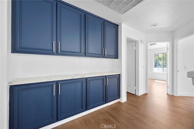 827 La Cadena Ln, Corona, CA 92879 - hallway featuring wood finished floors and baseboards