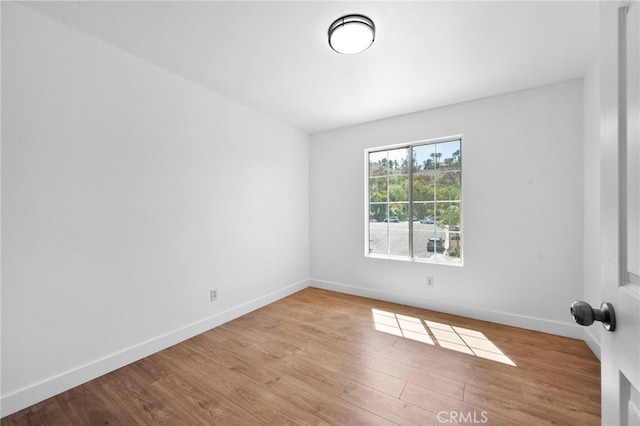 827 La Cadena Ln, Corona, CA 92879 - unfurnished room with wood finished floors and baseboards