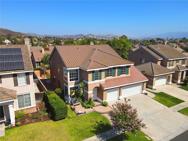827 La Cadena Ln, Corona, CA 92879 - view of front facade with a tile roof, concrete driveway, a chimney, and stucco siding