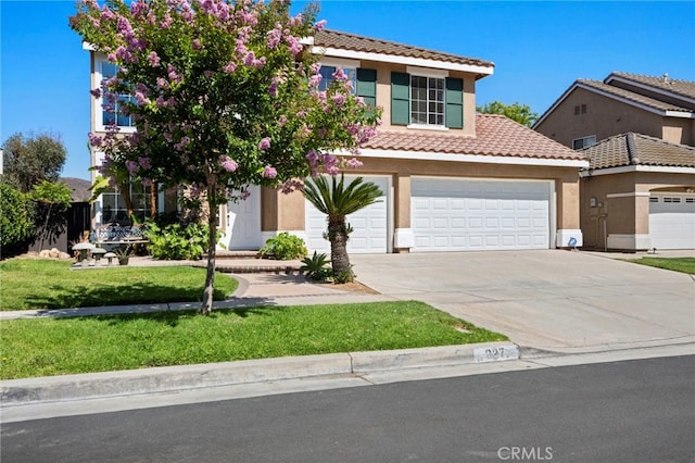 827 La Cadena Ln, Corona, CA 92879 - view of front of property with a tile roof, driveway, stucco siding, and a front lawn