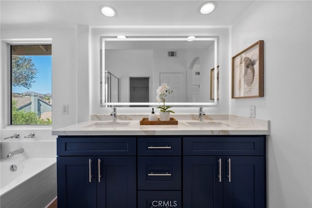 827 La Cadena Ln, Corona, CA 92879 - full bathroom featuring double vanity, a bath, and healthy amount of natural light