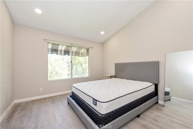 29 Stanford Ct Unit 93, Irvine, CA 92612 - bedroom featuring wood finished floors, vaulted ceiling, and recessed lighting
