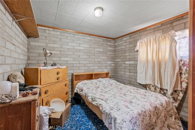 72082 Winters Rd Unit 29, Palms, CA 92277 - bedroom featuring crown molding and brick wall