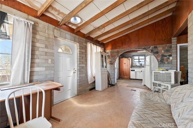 72082 Winters Rd Unit 29, Palms, CA 92277 - entrance foyer featuring arched walkways, concrete floors, and brick wall